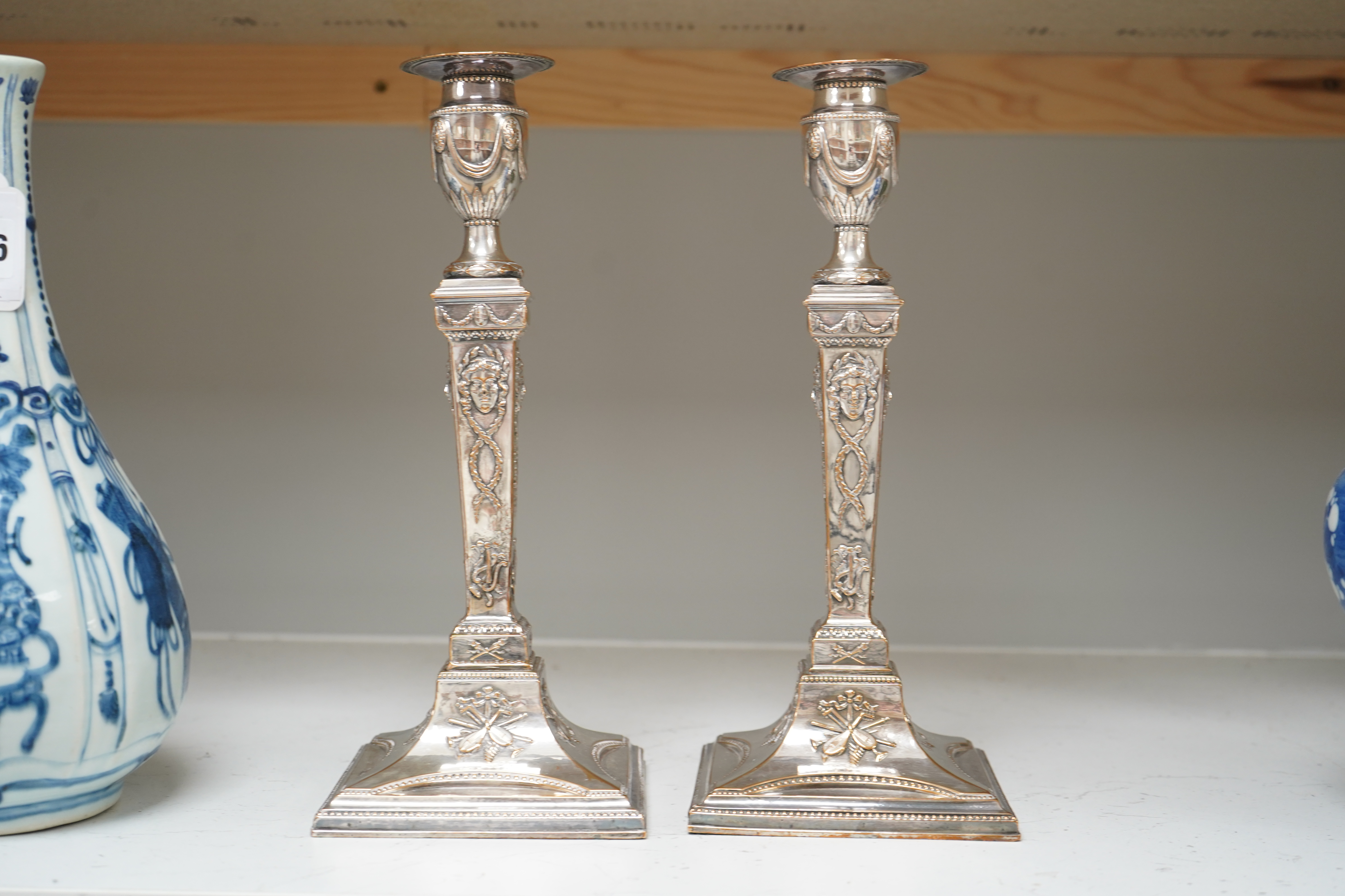 A pair of Adam design silver plated candlesticks, 29cm. Condition - worn